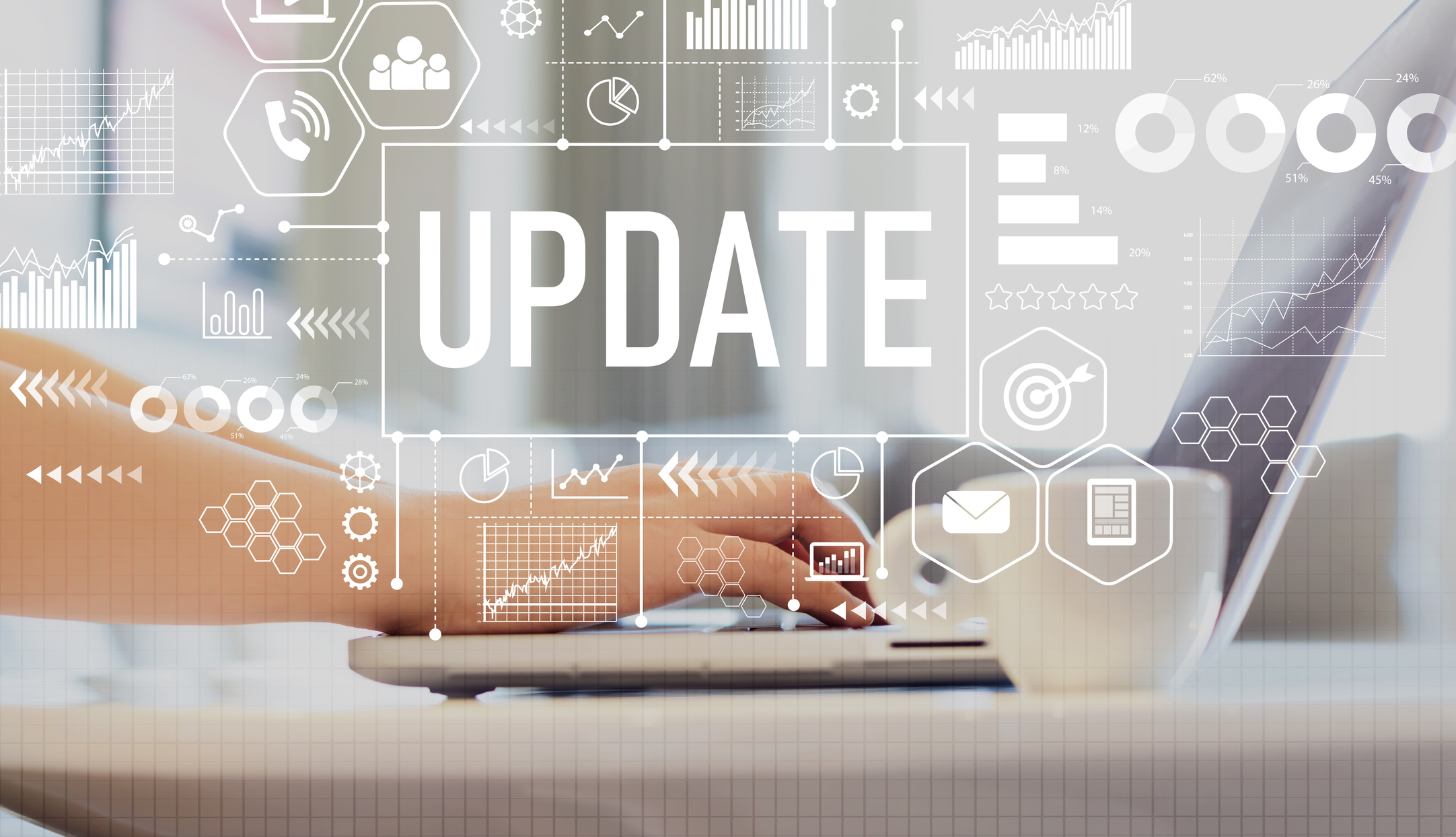 Update with woman using a laptop on a coffee table